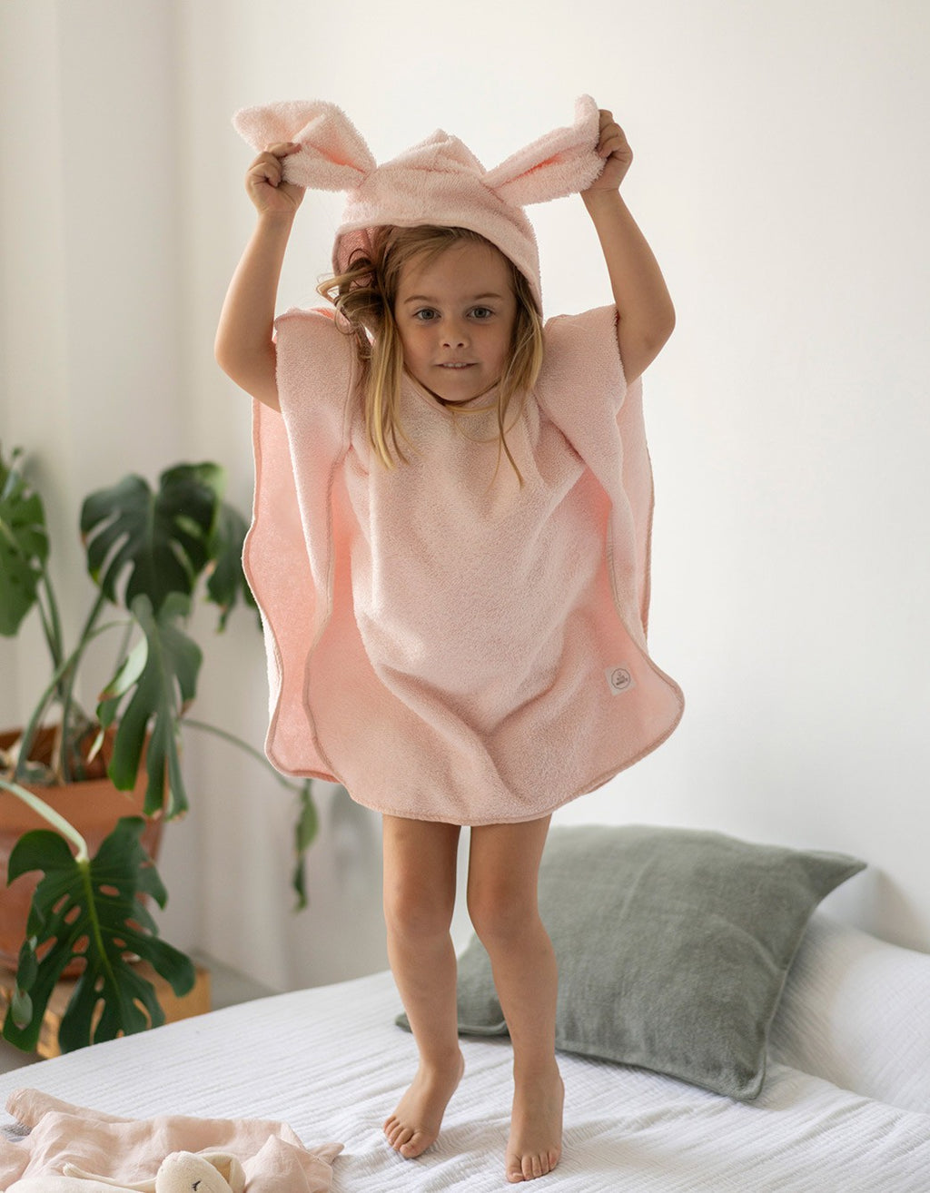 Poncho de toalla rosa