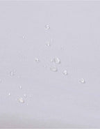 Protector de colchón para cama 90x200 cm con superficie impermeable resistente a líquidos.